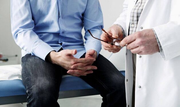 Male with a doctor who has symptoms of prostatitis